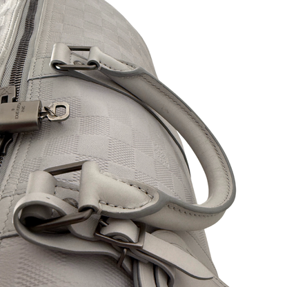 Louis Vuitton Infini Keepall 45 Bandoulière reistas lichtgrijs